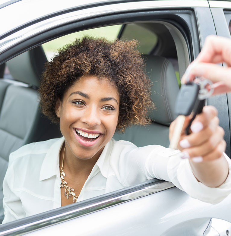 lady driving a new car