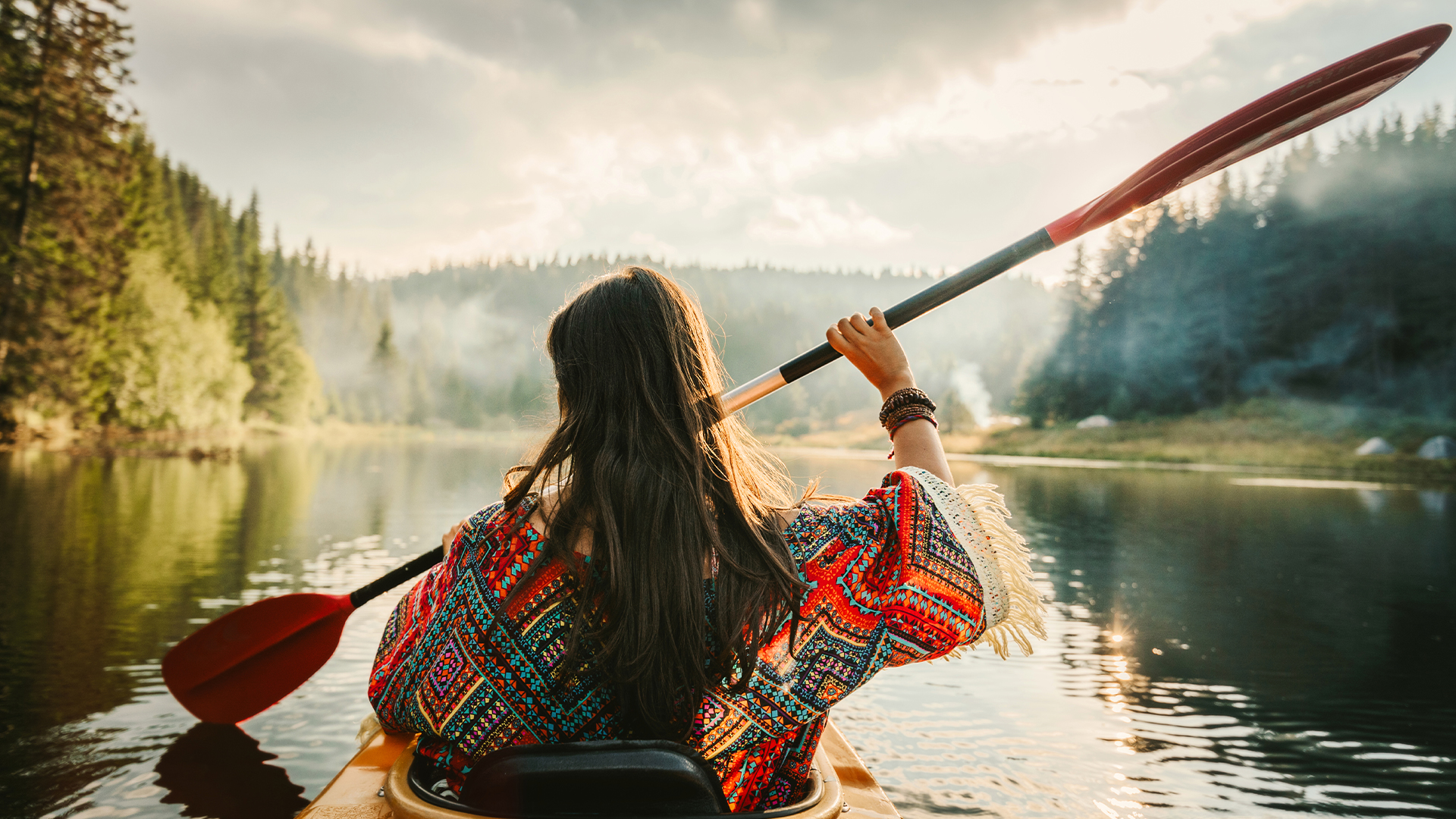 female canoeing in the wilderness