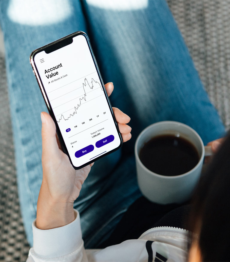 lady looking at forex trading and drinking coffee