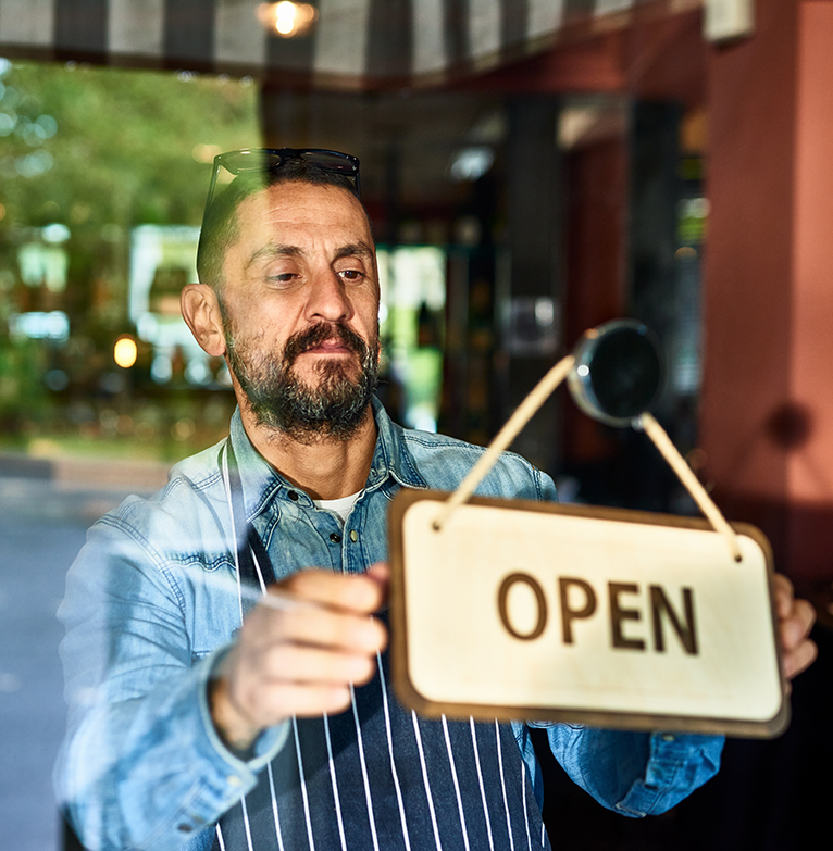 man opening his business