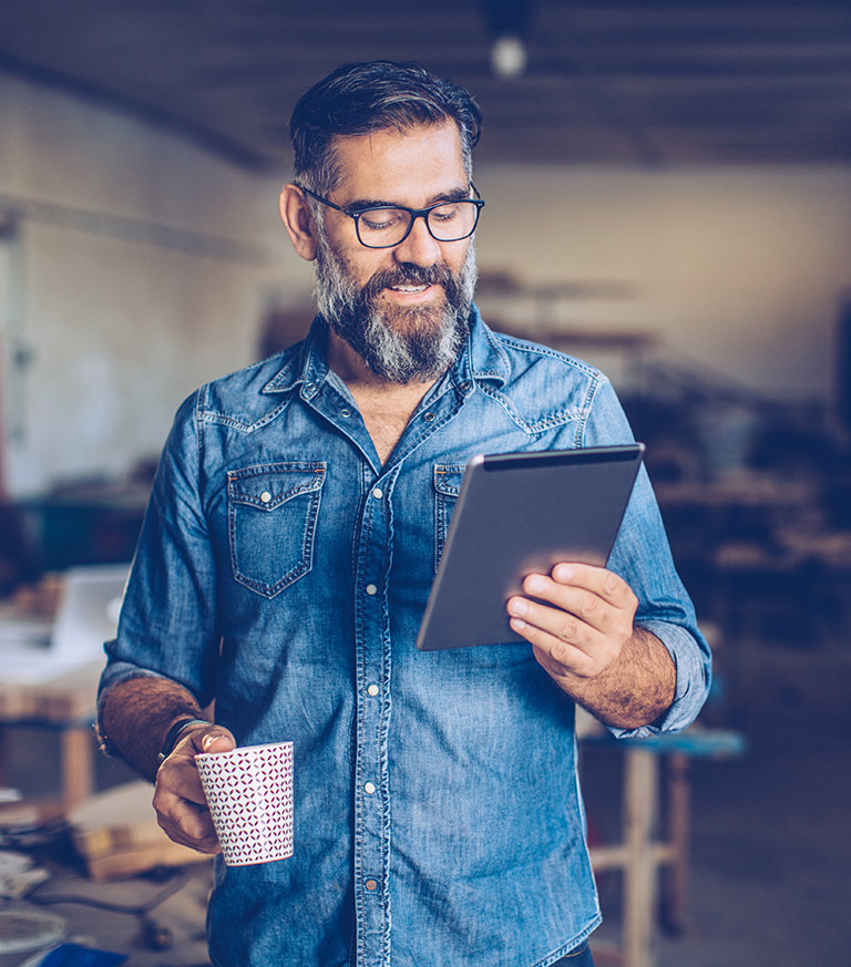 business man looking at his tablet