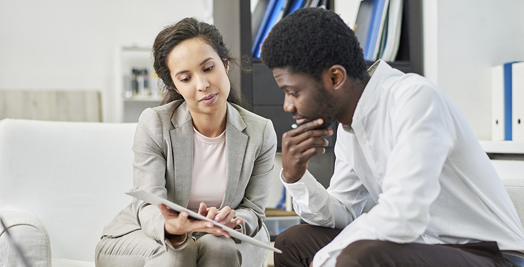 Young man receiving advice from HR