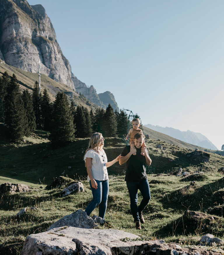 family of three talking a walk