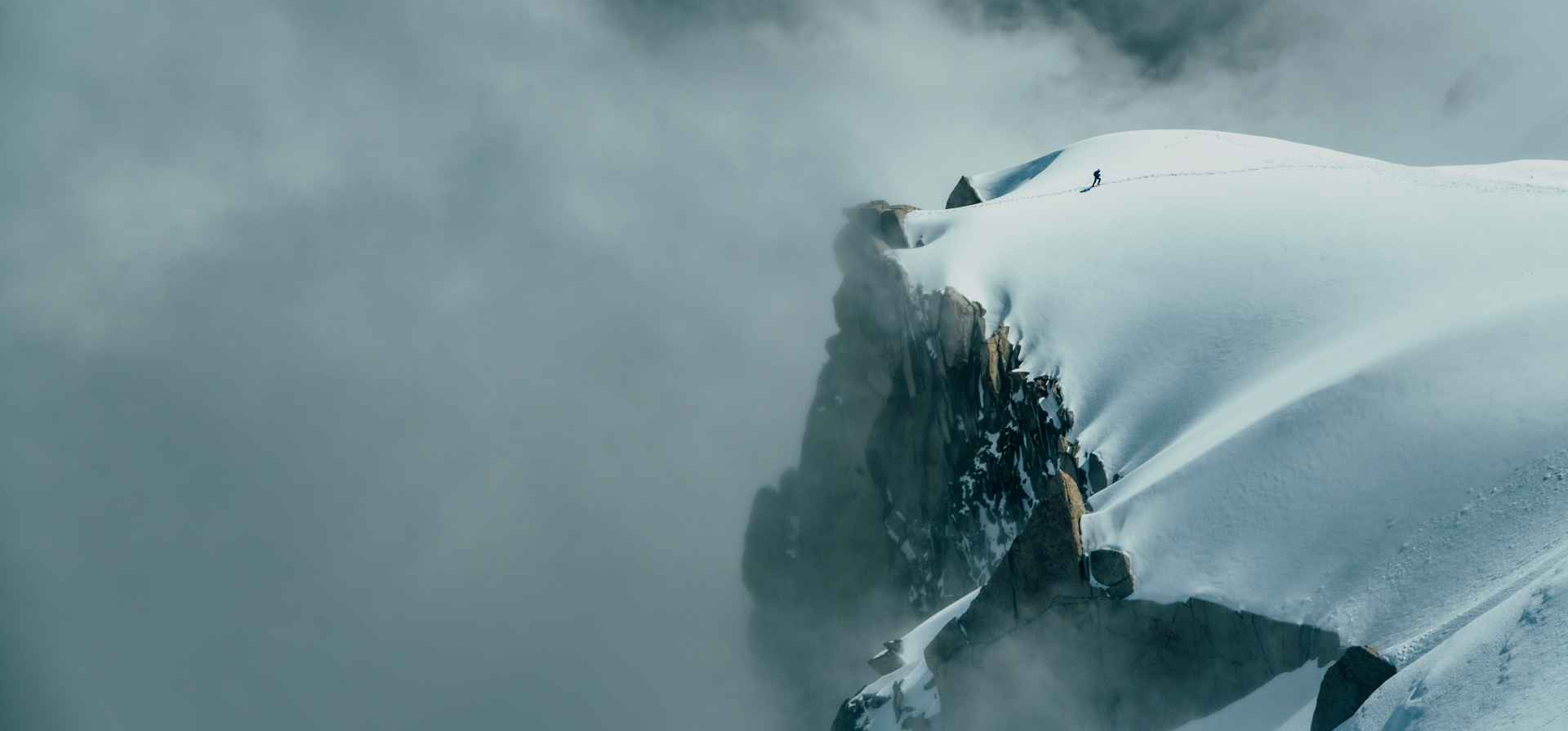 Man on a snowy mountain top