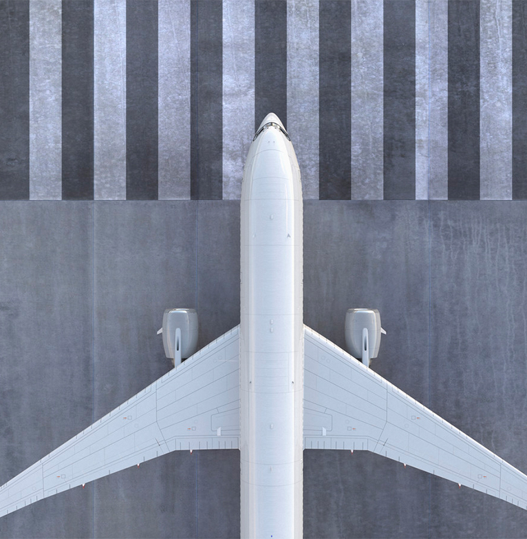 View of aeroplane on tarmac from above