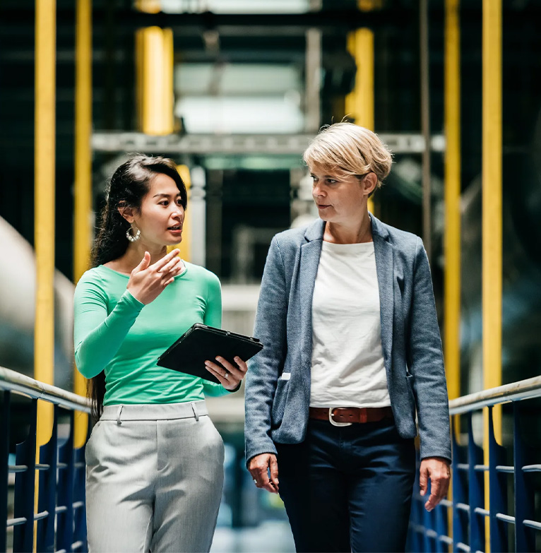 Businesswomen walking and talking
