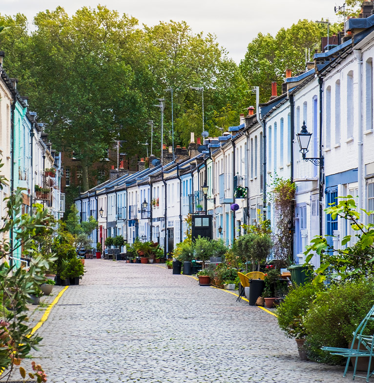 Row of terraced houses along a cobble street