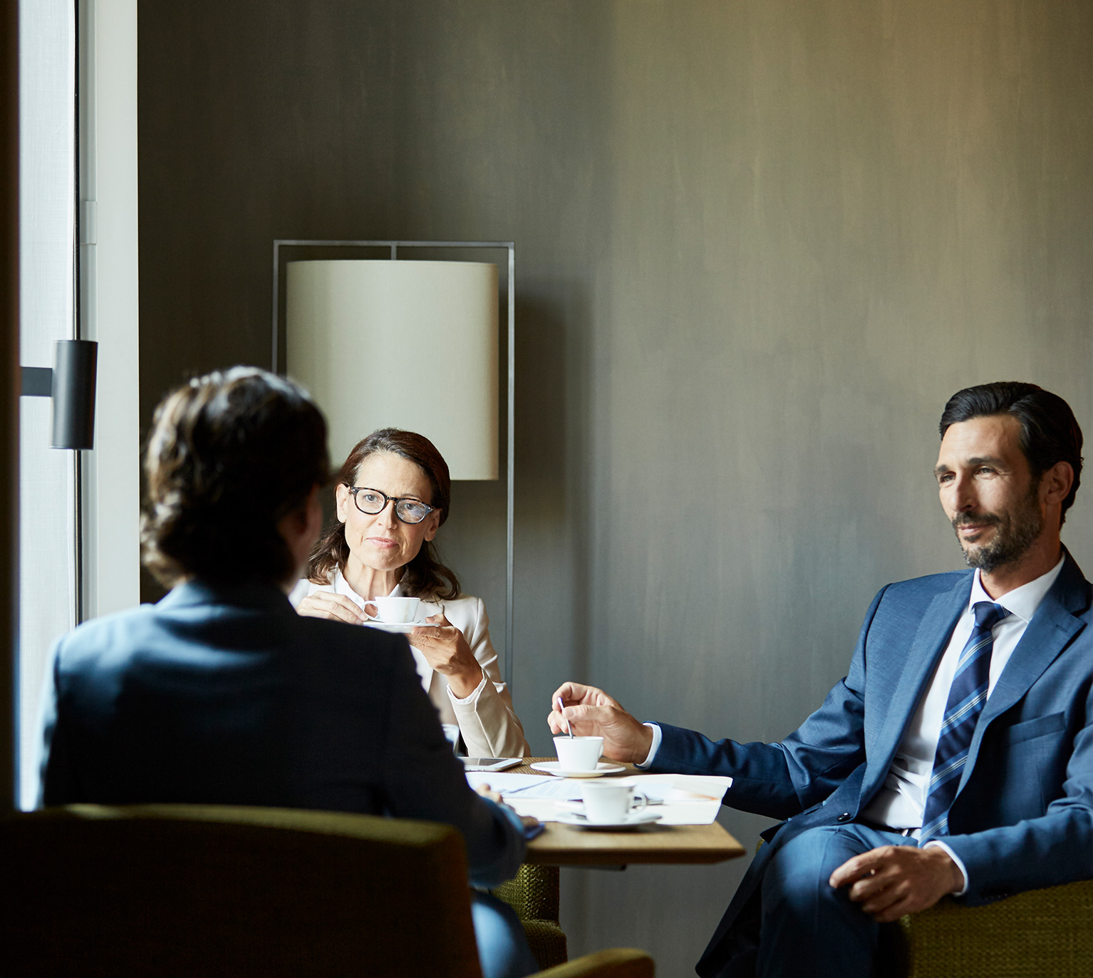 advisory chatting with two clients