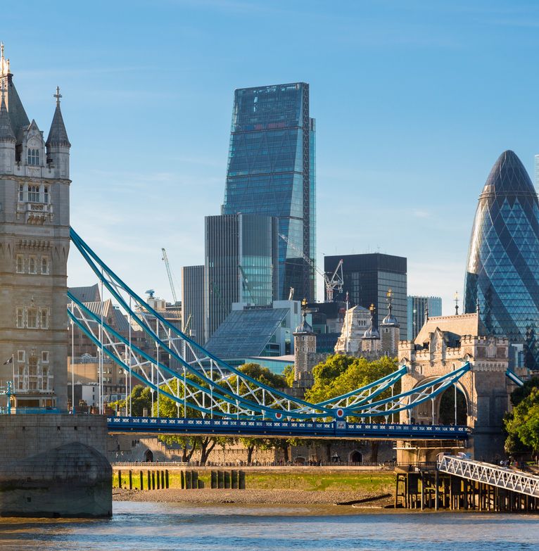 A view across the Thames and Tower Bridge to the City of London's skyscrapers