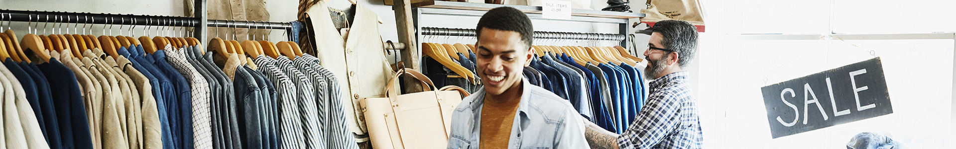 Shop owners arrange shirts