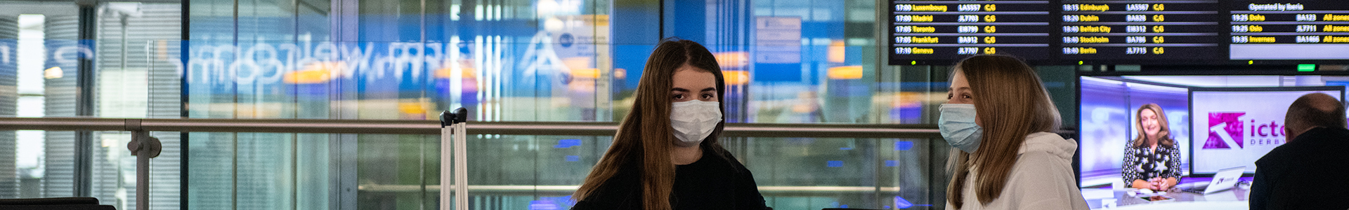 Two passengers waiting for their flight in Heathrow