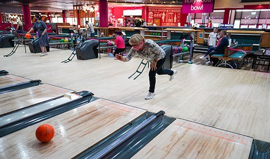 Woman bowling at a Hollywood Bowl location