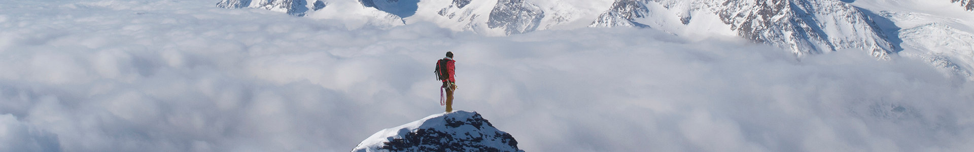 Mountaineer on top of a mountain