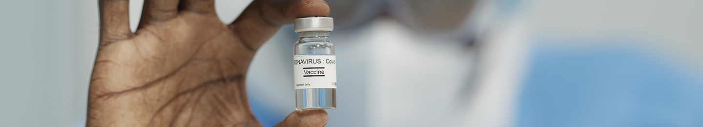 Nurse holding a vial of the Covid-19 vaccine