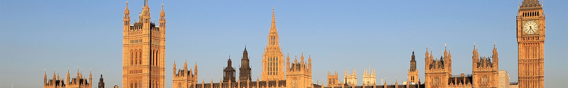 The Houses of Parliament are bathed in the light of early morning sunshine.