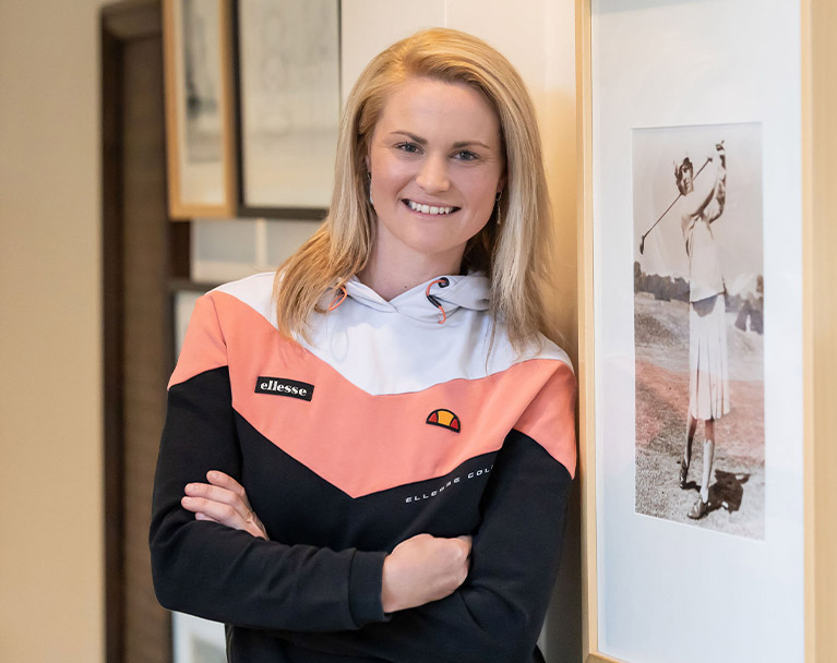 Carly Booth, Scottish professional golfer, watching where her wedge shot lands