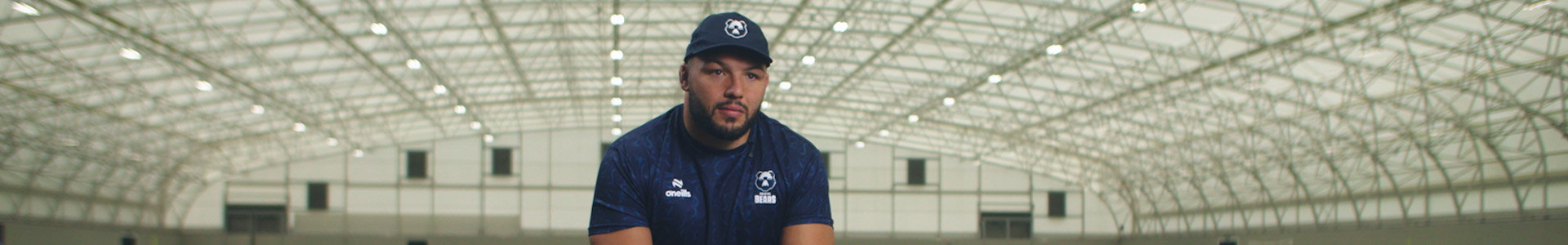 Ellis Genge, England and Bristol Bear's rugby player, chatting while sitting on jumping block