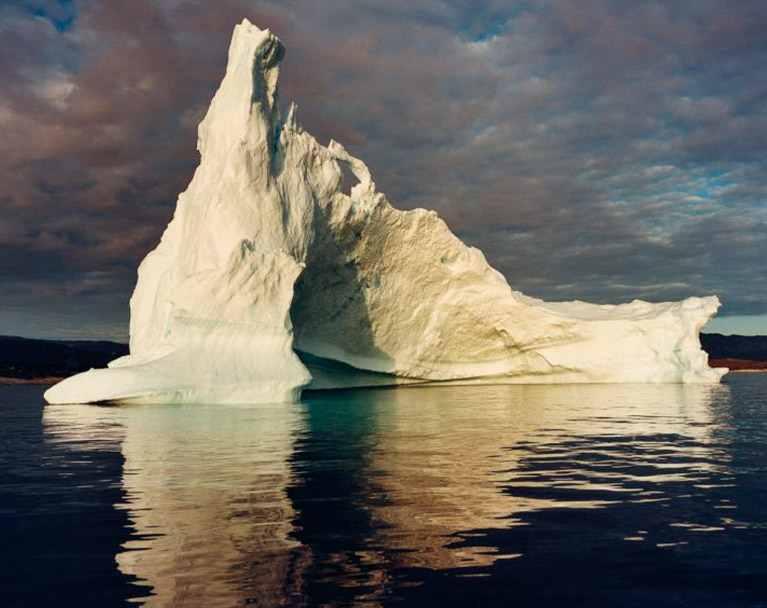 Iceberg floating on its own in the ocean