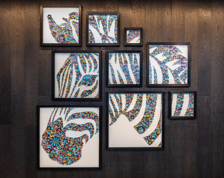 Sarah Turner's wall mounted zebra-themed artwork using recycled drink cans