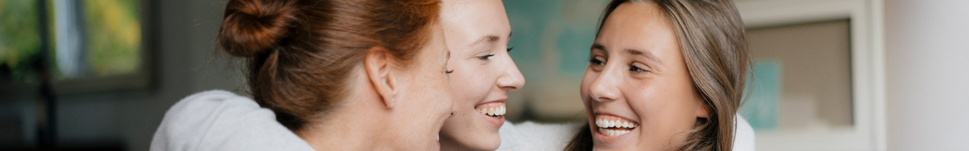 Young friends hug, as they understand how to manage money