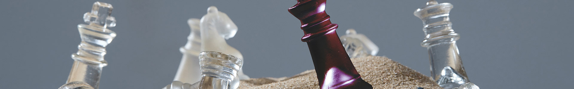 Chess pieces in sand