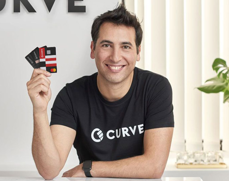 Male holding curve cards