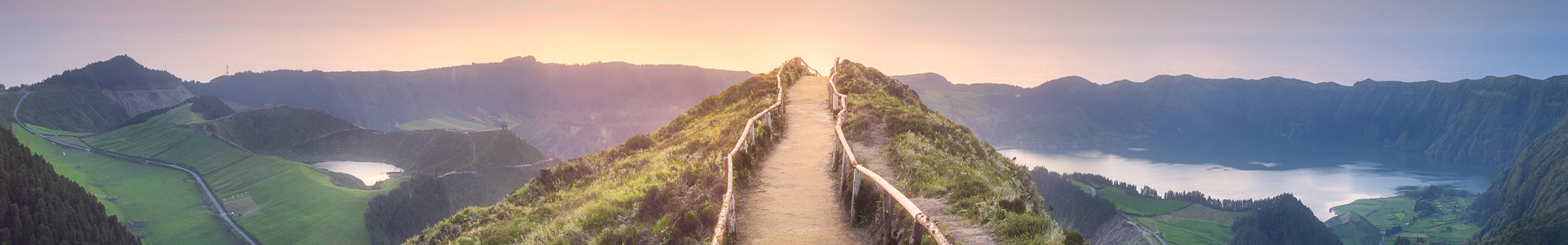 Walkway at the top of a mountain overlooking lake