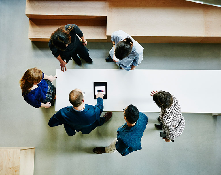 team discussing around a table