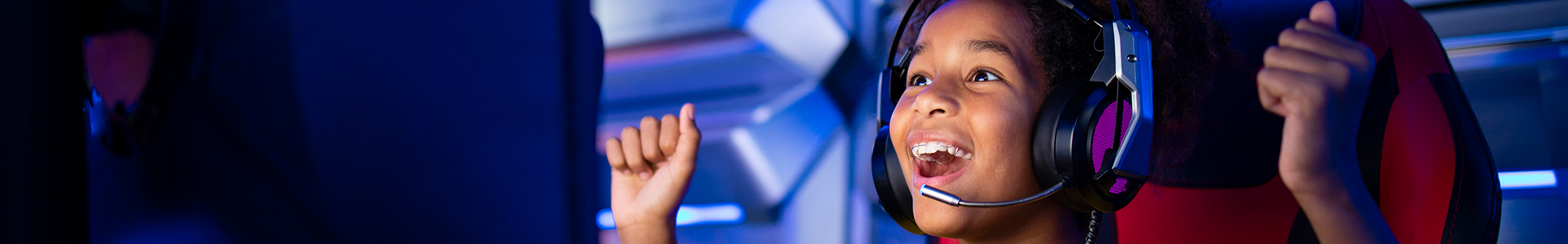 Young girl celebrating while gaming