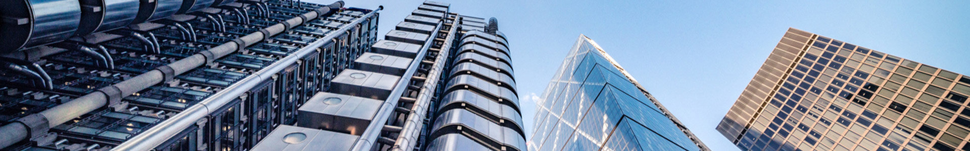Looking skywards at glass office towers in London financial district