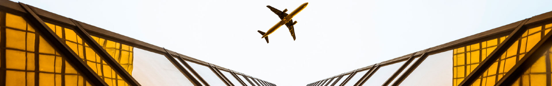 Aeroplanes flying over a office complex