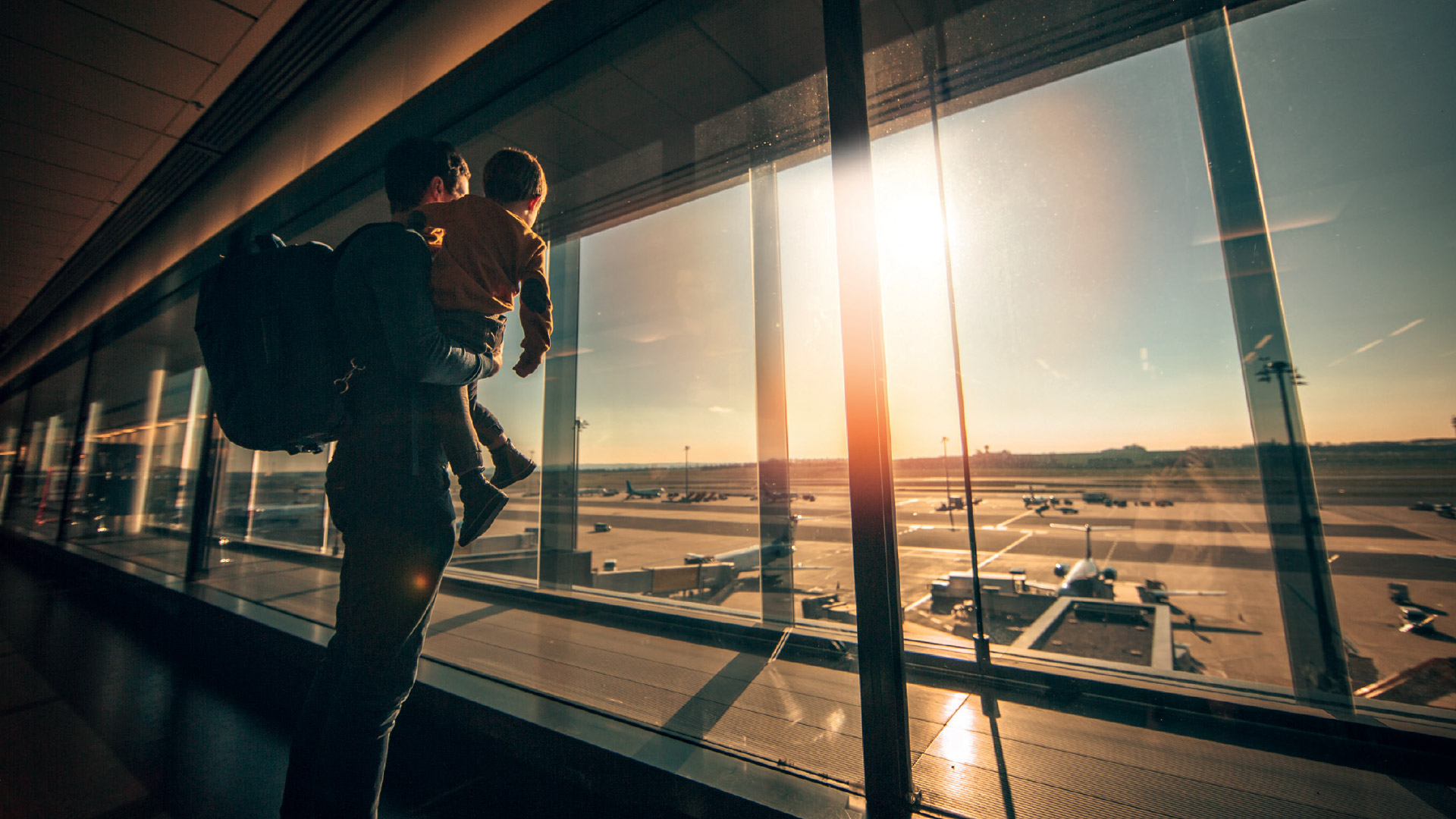 Dad with child at airport