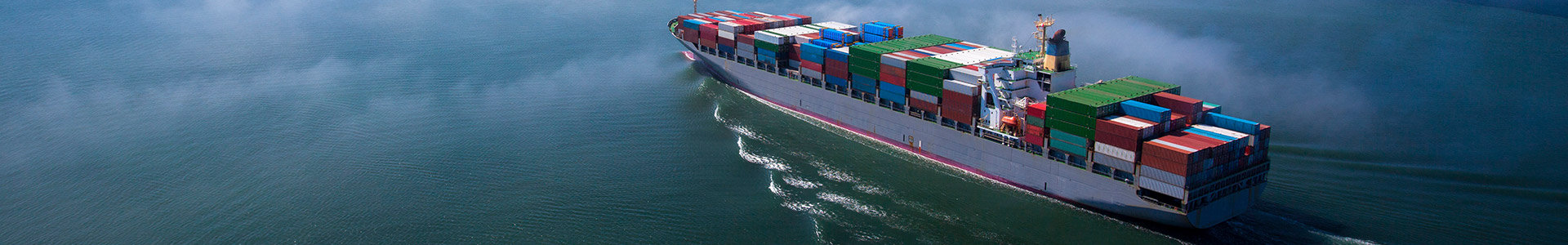 Cargo ship sailing through the ocean
