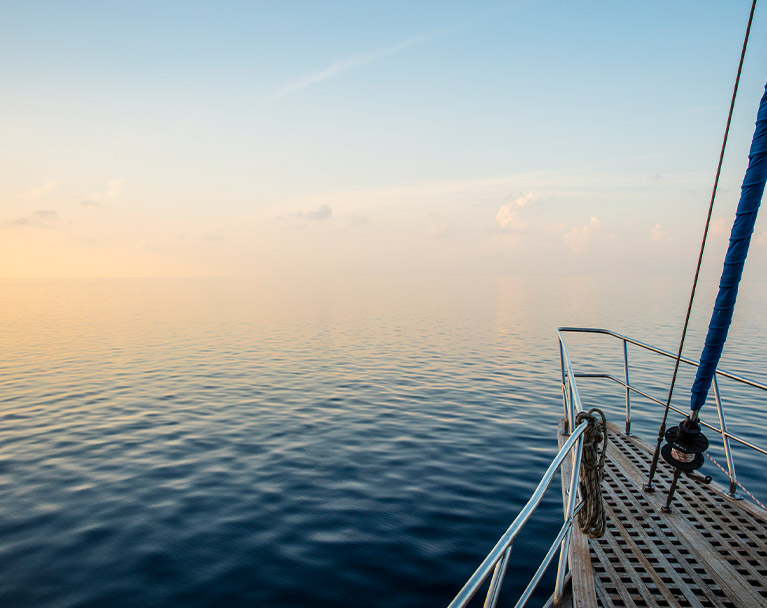 Looking out from the front of a sailing boat