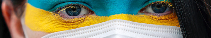Colours of ukraine flag painted on female face