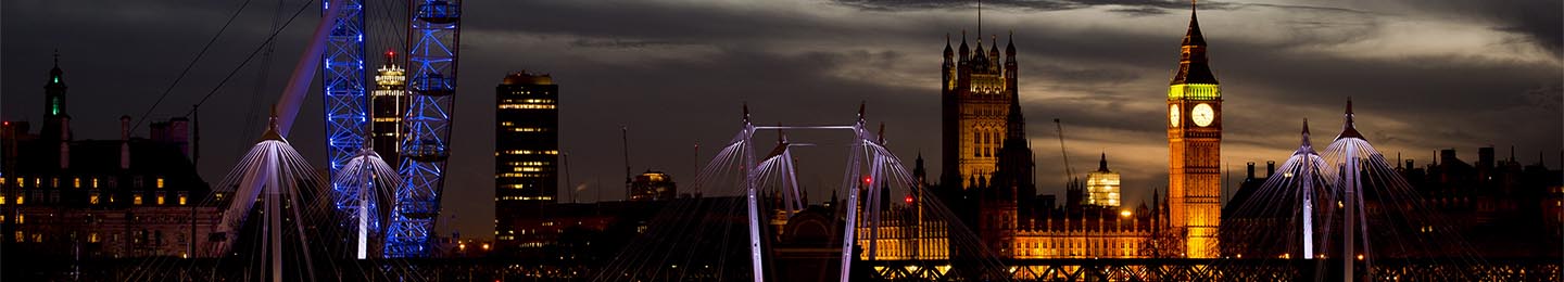 The sun sets across Westminster and the London Eye on Christmas Day on December 25, 2013 in London, England