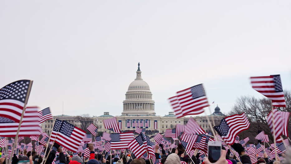 Waving American flags outside the White House