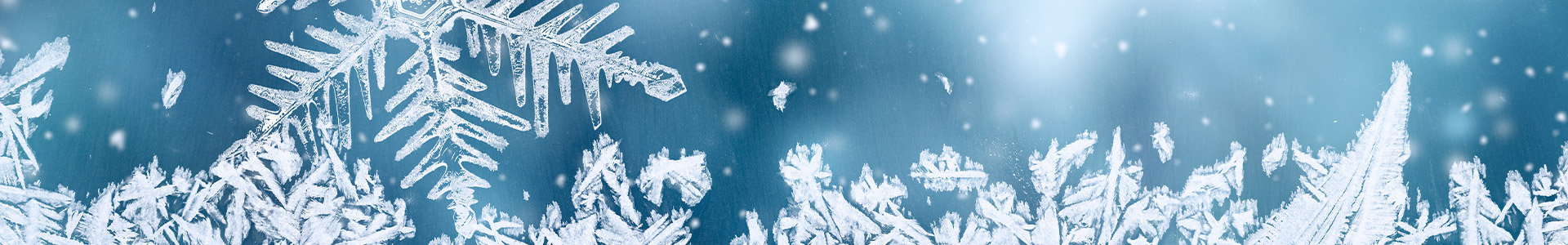 Snowflakes against blue background