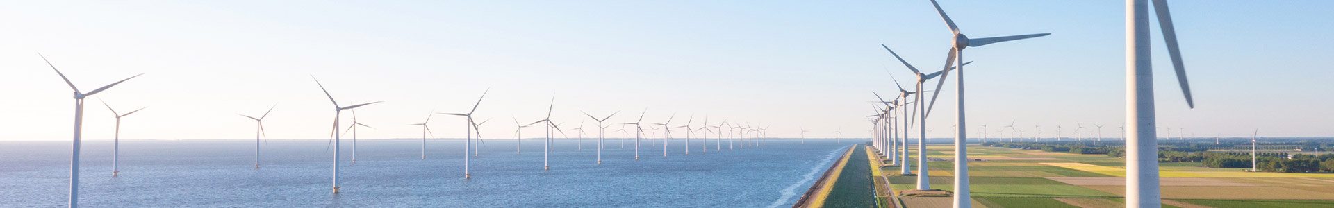 Wind farm with turbines on-shore and off-shore