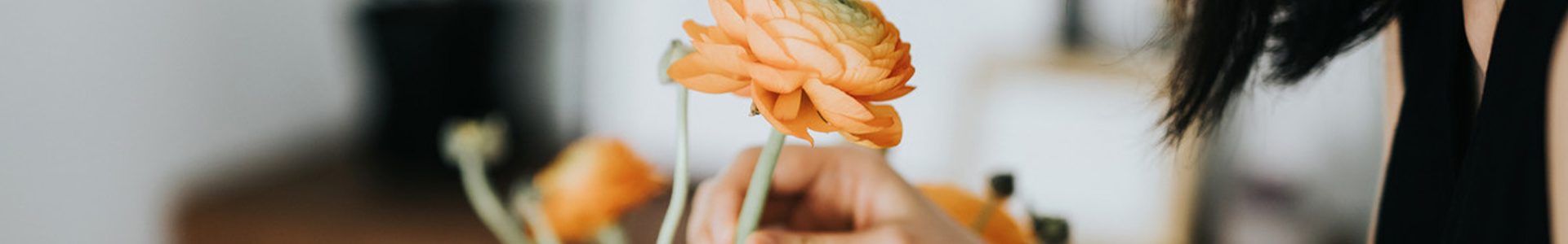 Female smelling flower