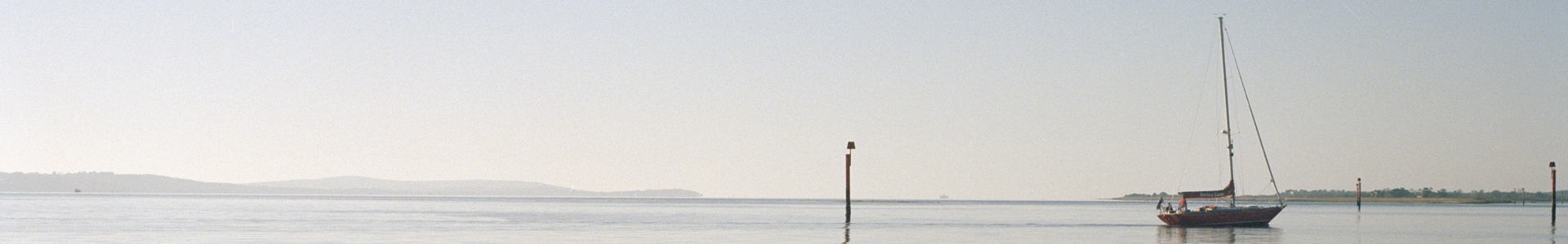 Sailing boat floating on a calm sea