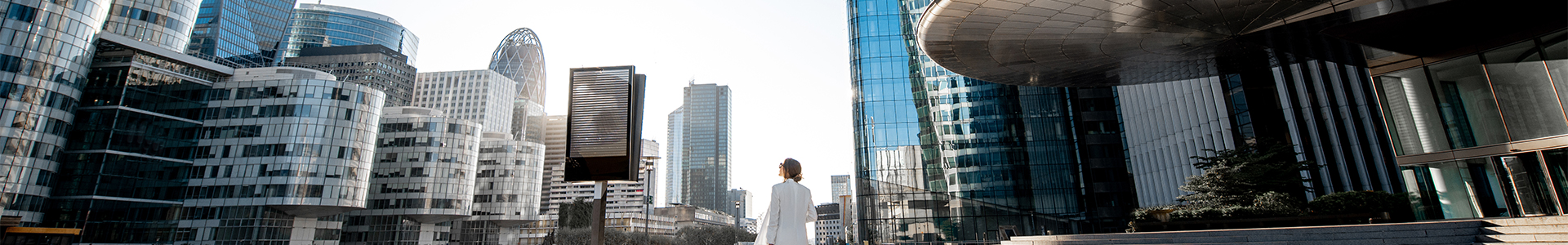 Female admiring the skyline of modern office buildings