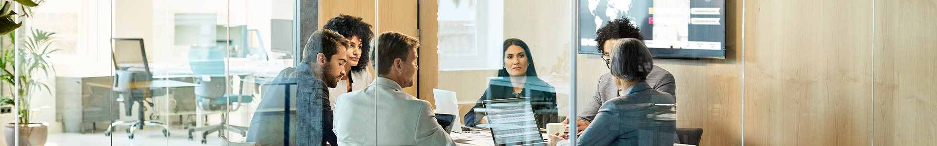 team discussing around a meeting table
