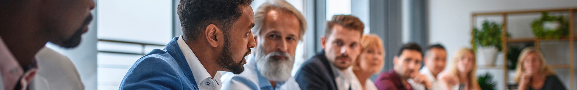 People discussing lending around a boardroom table