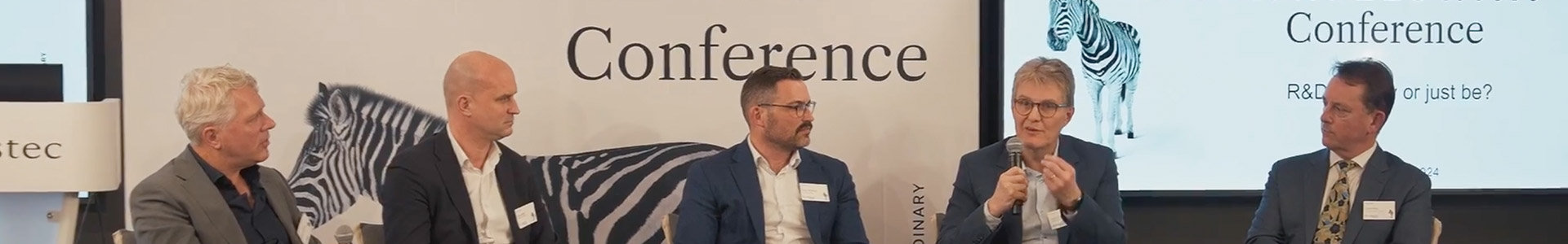 Speakers on the stage at the animal healthcare conference