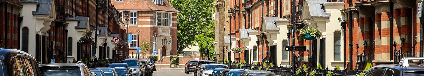 London Streets. A view down Glentworth Street, Marylebone, London NW1 towards Ivor Place. The stunning Edwardian red brick mansion blocks have wrought iron Art Nouveau balconies.