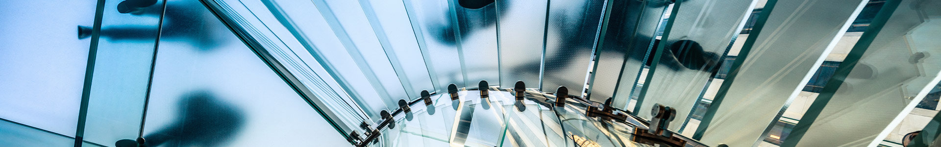 People walking on transparent glass staircase