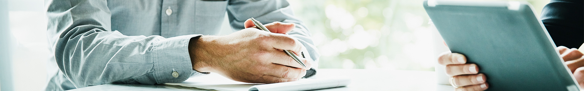 male discussing financial plans with financial adviser