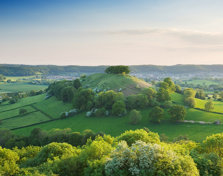 Countryside view with large hill in center