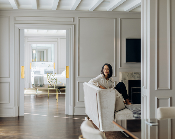 female looking around her modern lounge